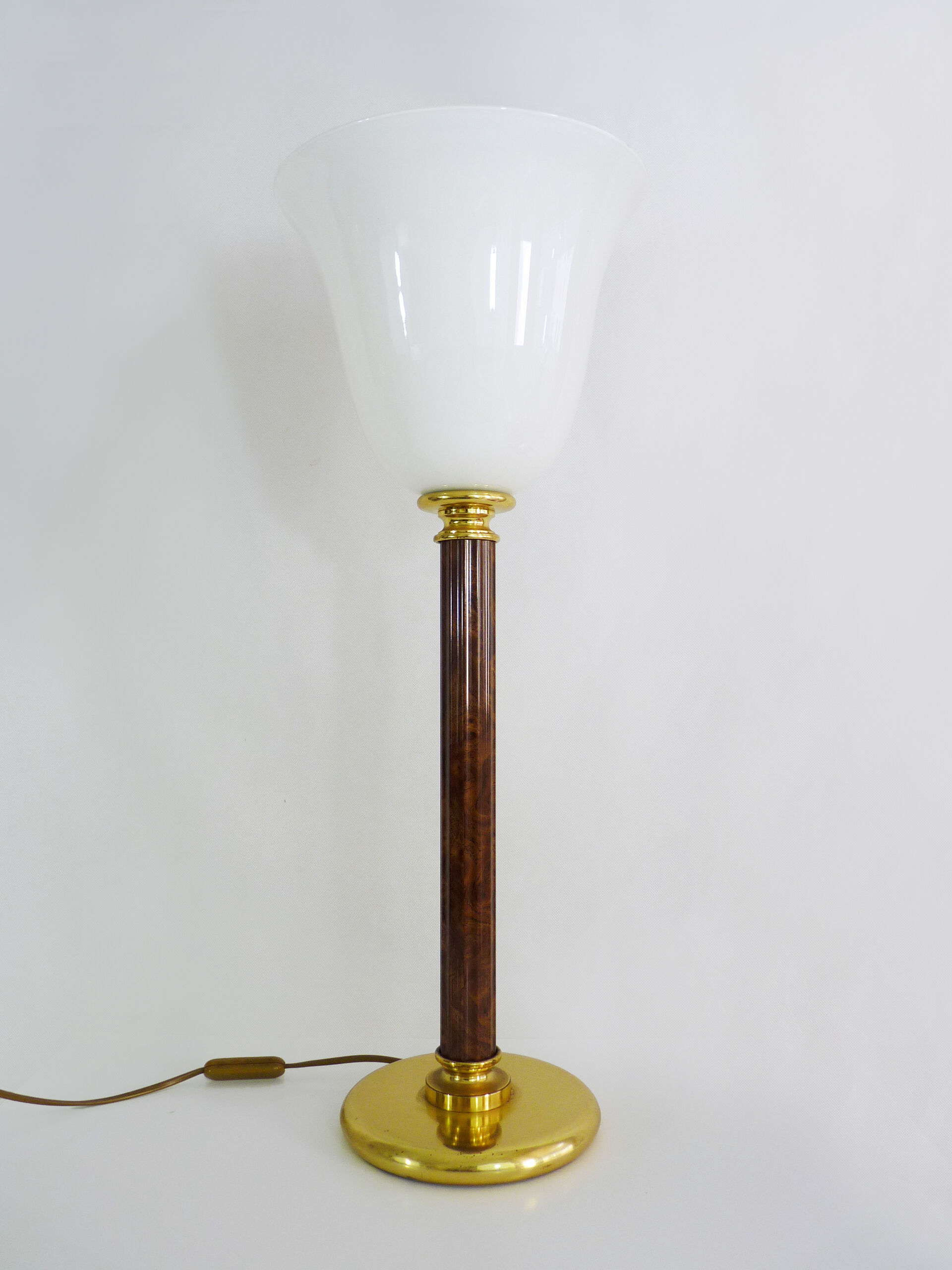 Mazda lamp in gilded metal, foot imitation wood and white opaline. Year 60