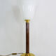Mazda lamp in gilded metal, foot imitation wood and white opaline. Year 60