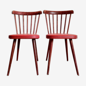 Pair of wooden bistro chairs and red imitation seating