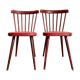 Pair of wooden bistro chairs and red imitation seating