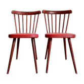 Pair of wooden bistro chairs and red imitation seating