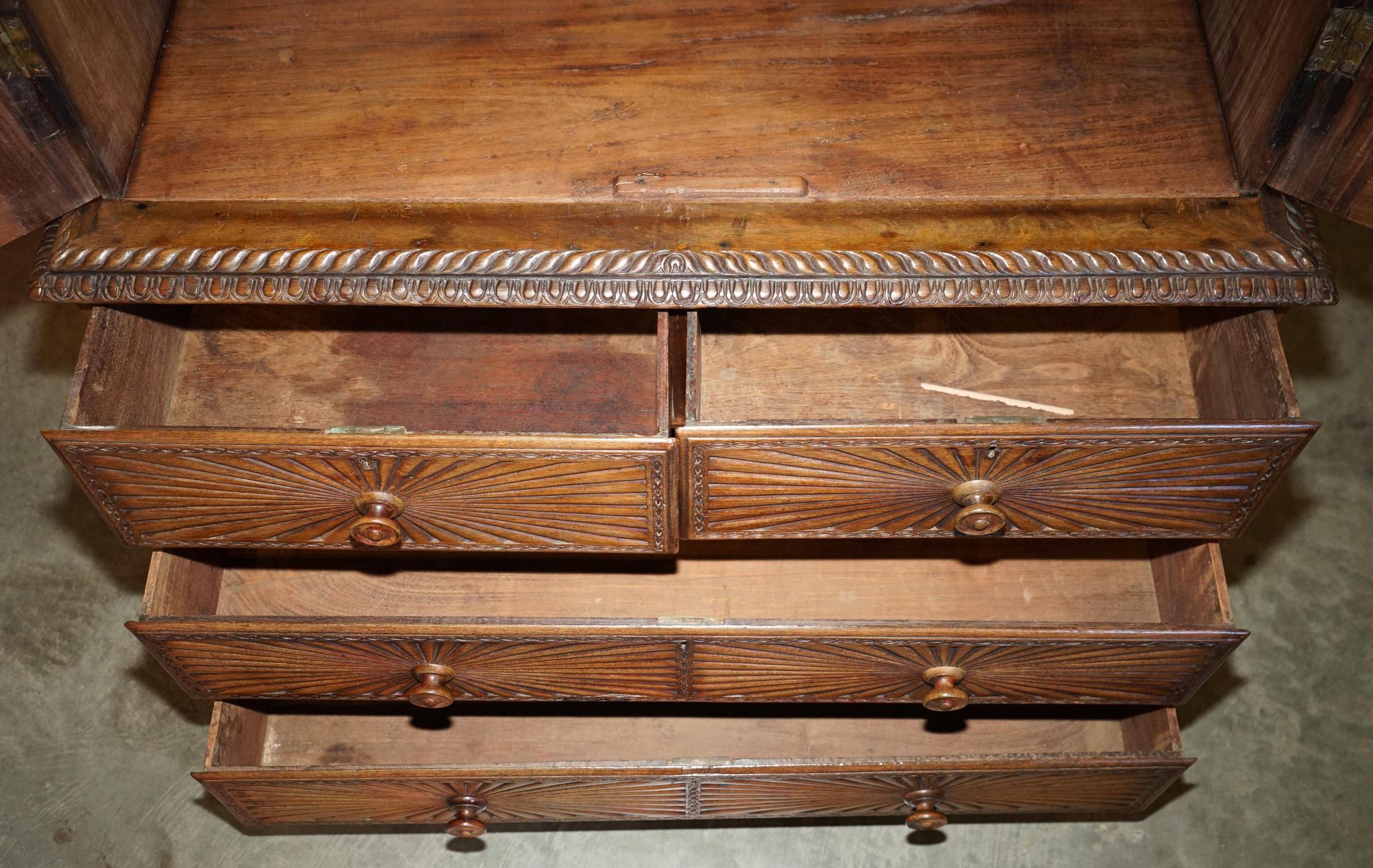 19th-century Anglo-Indian colonial hardwood library on a chest of drawers.