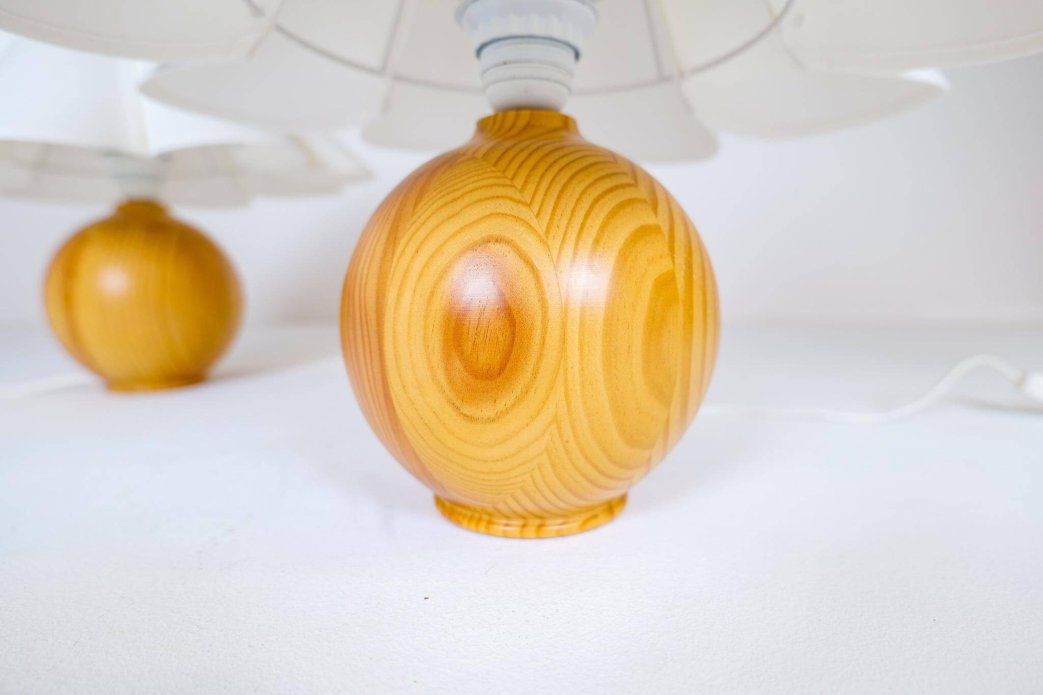Sculptural modern table lamps from the mid-century in solid pine, Sweden, 1970s.