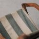 Foldable chair in solid wood and striped fabric, circa 1900.
