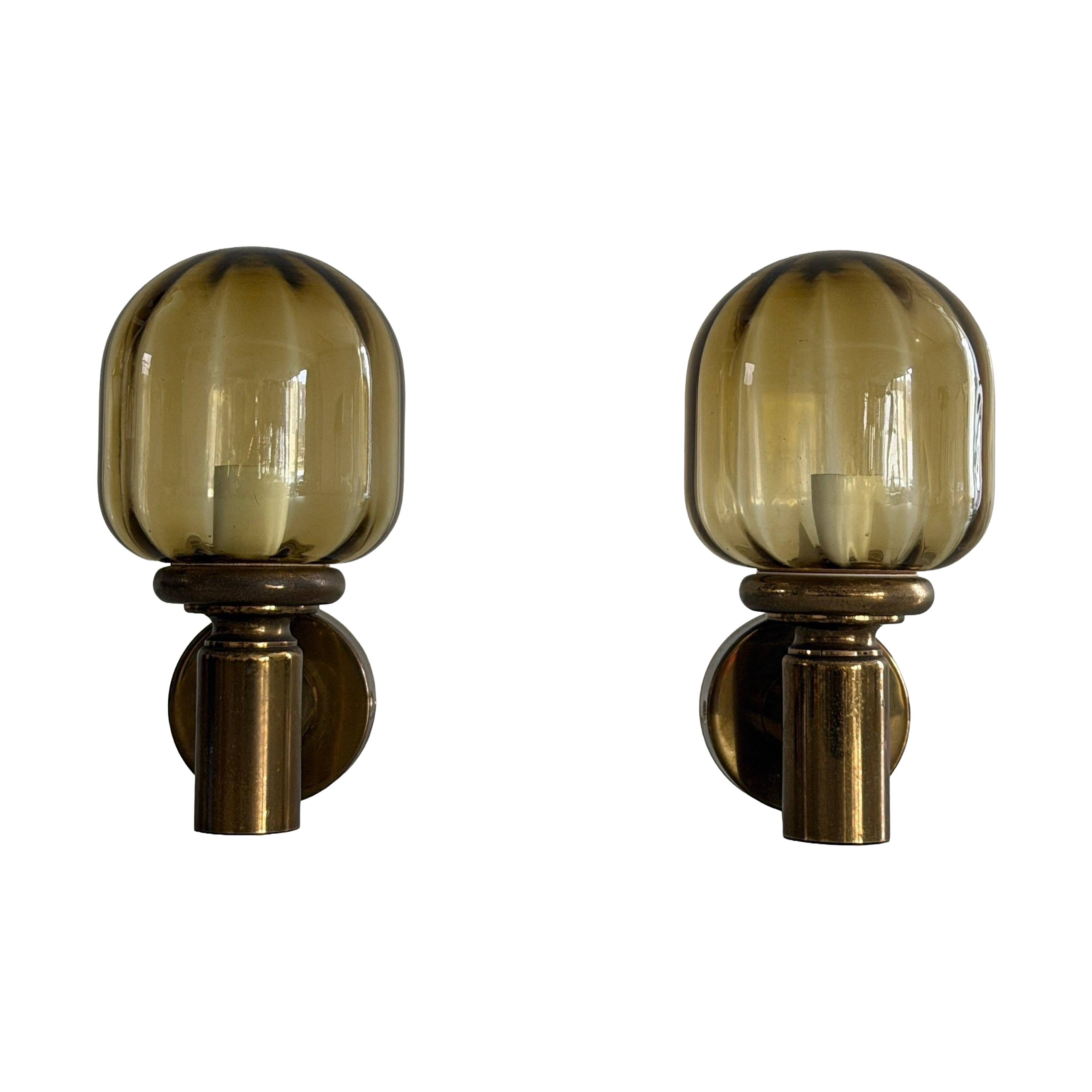 Pair of yellow glass and brass wall lights from the mid-century by N Leuchten, 1960s, Germany.