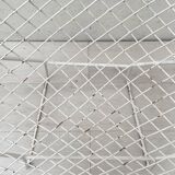 Pair of armchairs in white patinated mesh metal.