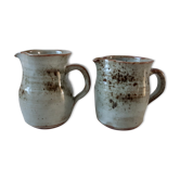 Duo of pitchers in vintage sandstone