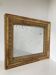 Small stuccoed and gilded wooden mirror from the Restoration period.