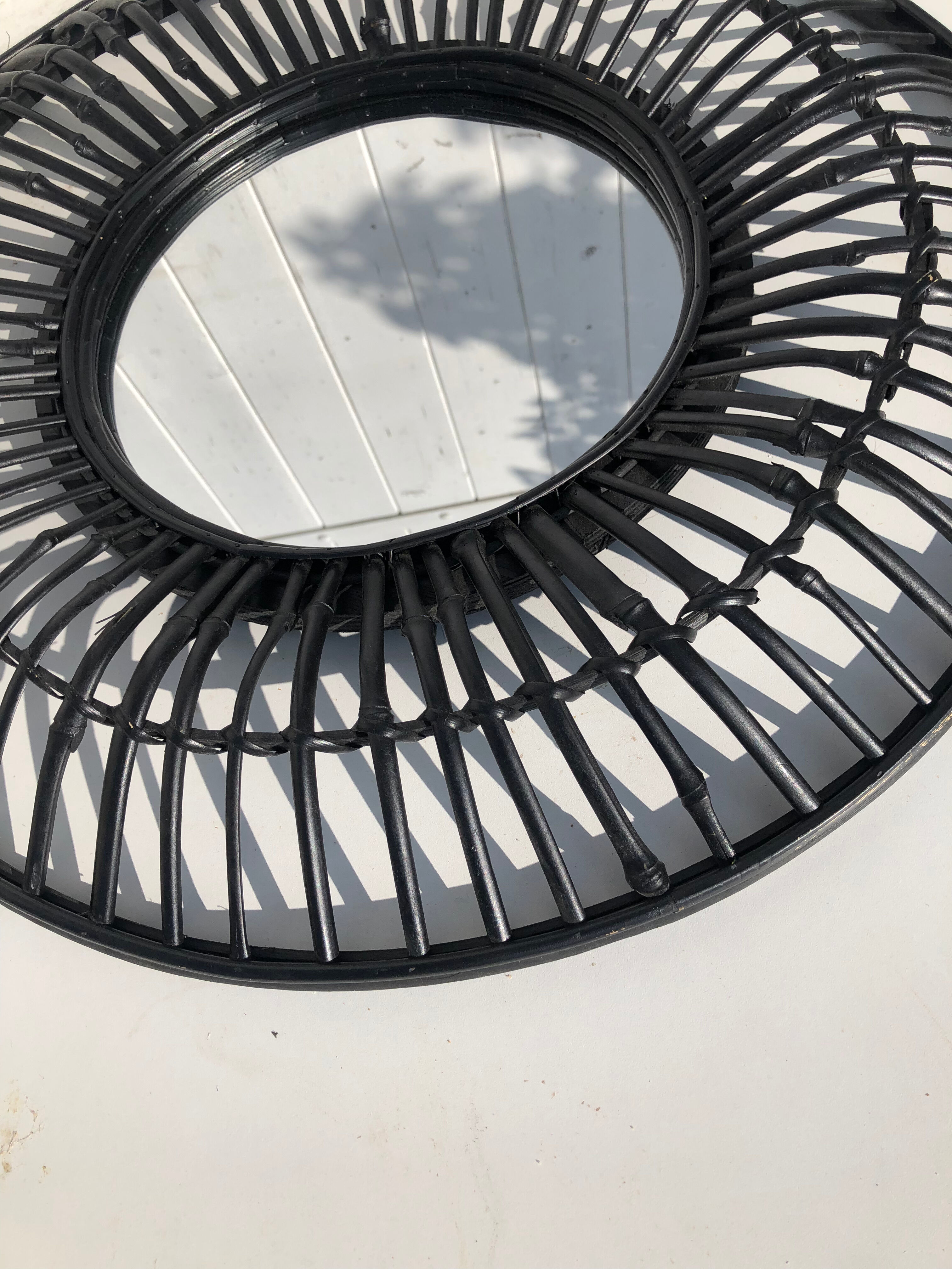 Round black rattan mirror