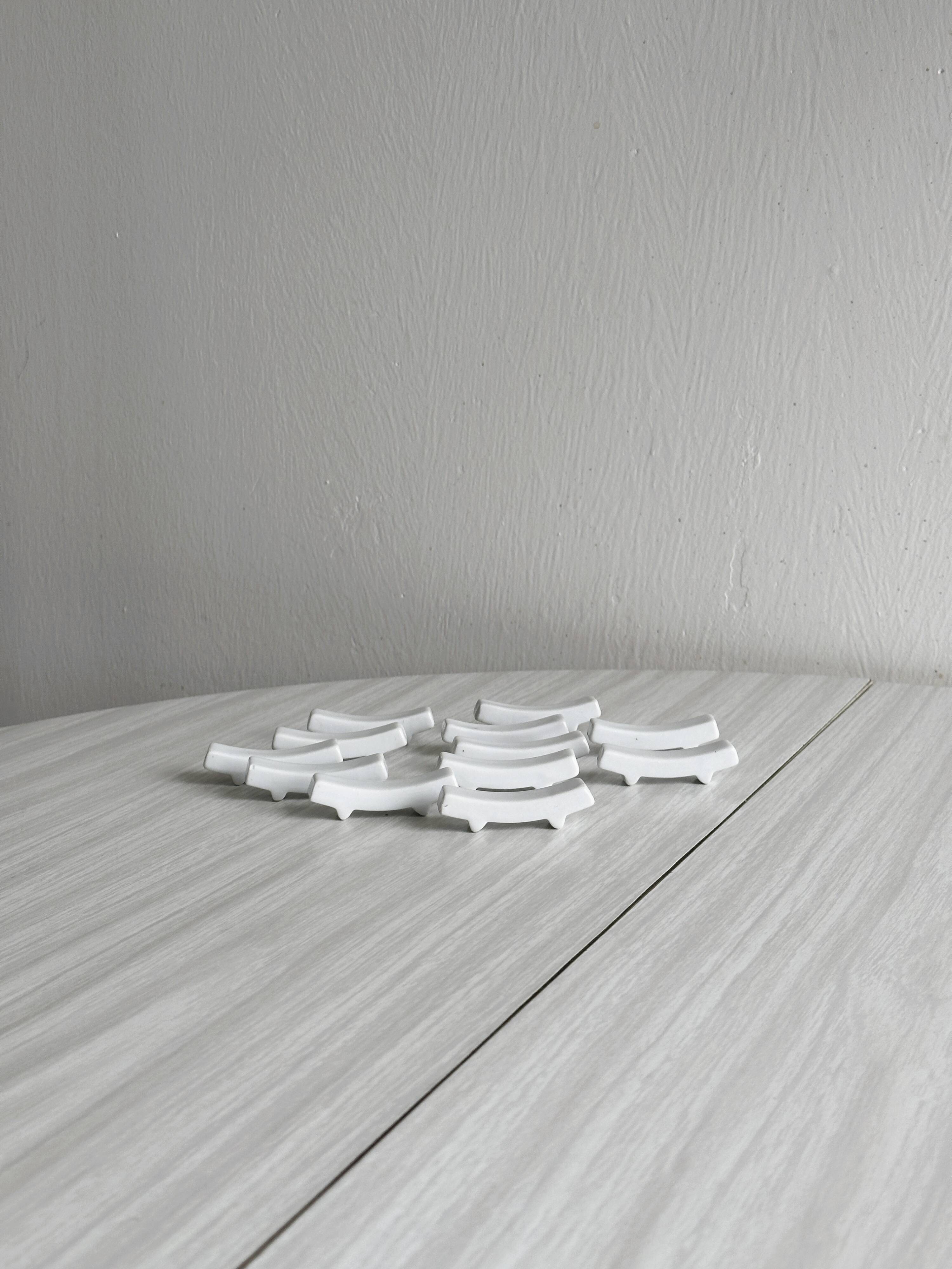 Set of white porcelain chopstick holders