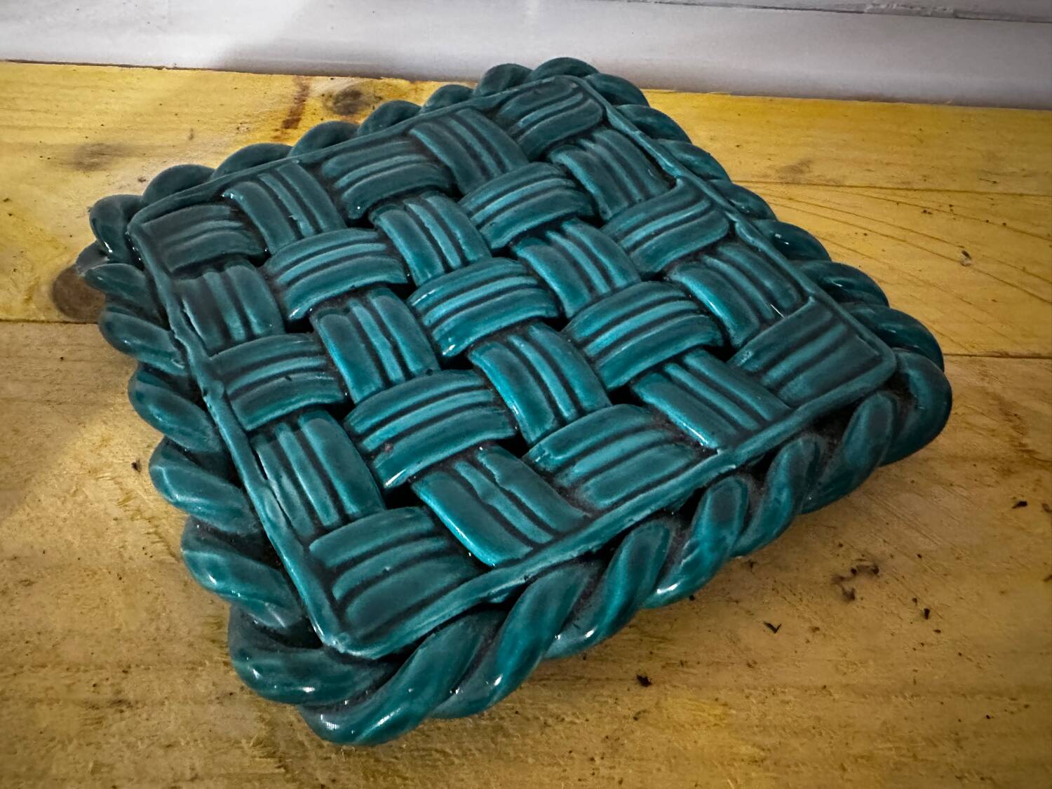 Woven ceramic trivet from Vallauris in the Massier style.
