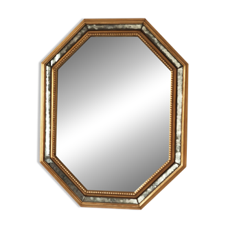 Antique mirror with gilded wooden frame.