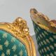 Pair of Louis XV style gilded armchairs with vintage green fabric
