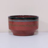 Brown bowl with a green and blue design