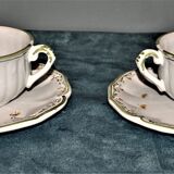 Two MOUSTIER cups decorated with flowers signed
