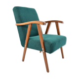 Green curved armchair