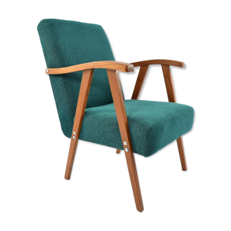 Green curved armchair