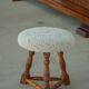 Modern Danish stool, with three oak legs featuring turned feet and a lambswool seat, 1950s.