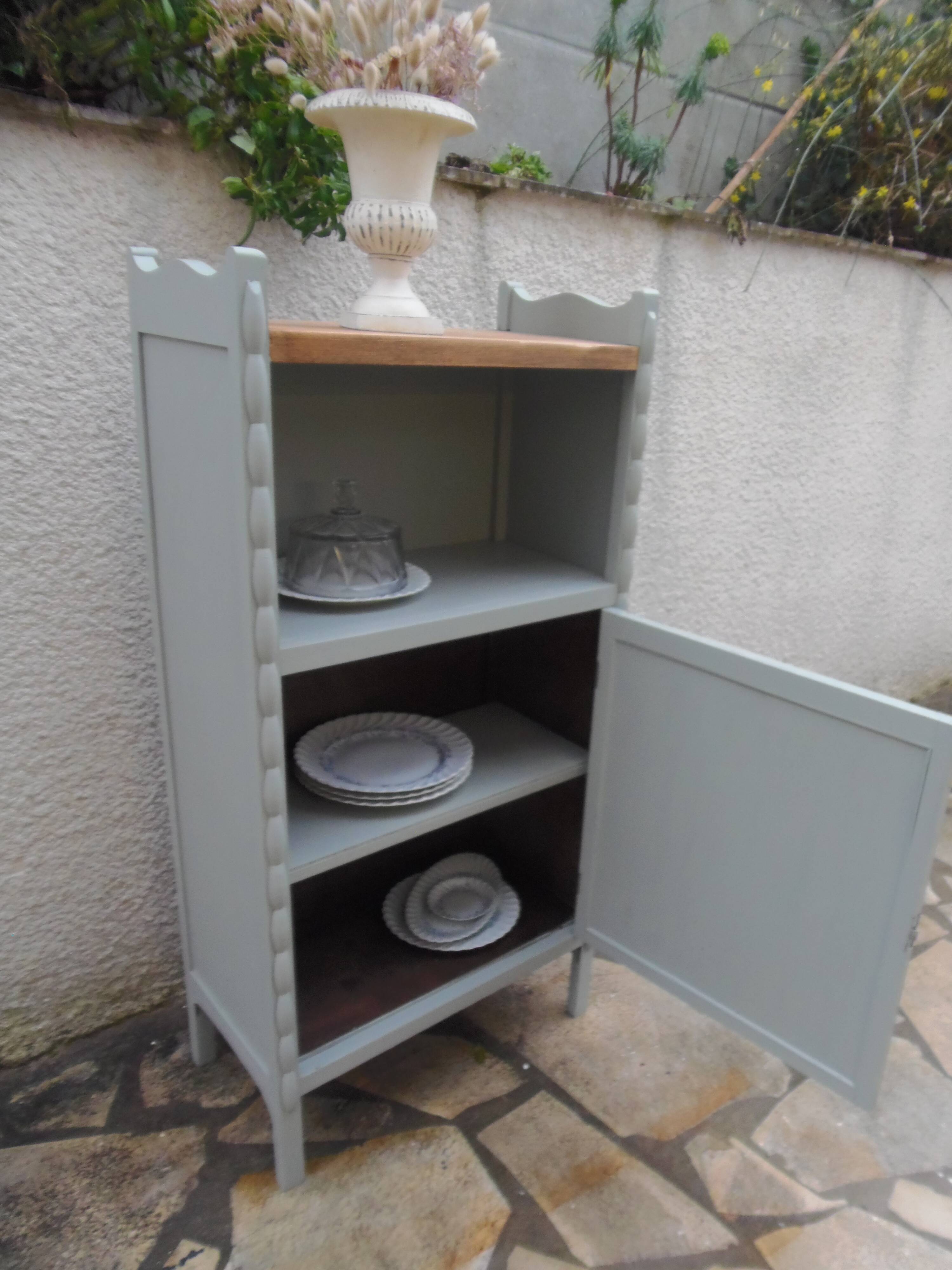 Vintage furniture of shallow depth re-enchanted in grey-green.
