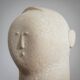 Modernist sculpted male bust in sandstone