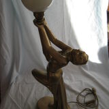 Lamp depicting a with a drape