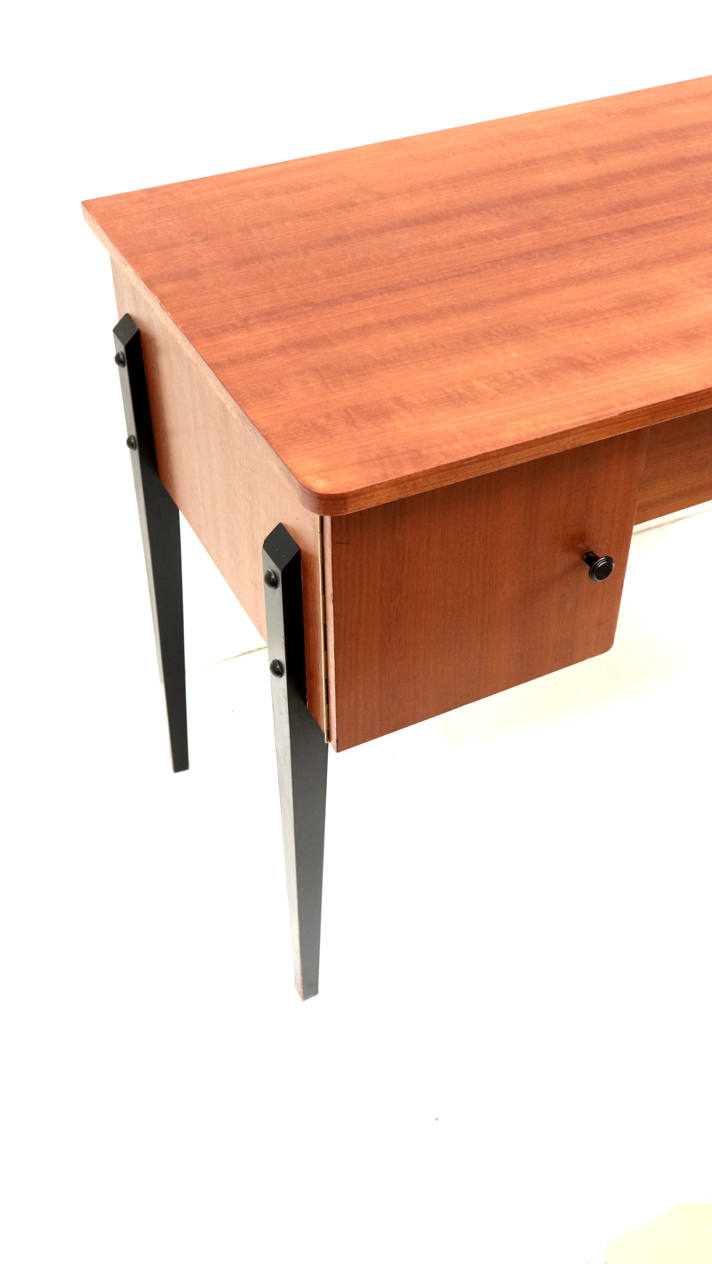 Elegant vintage desk with black legs made in the 60s