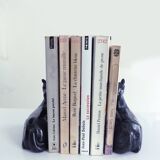 Black marble bookends with lying horses
