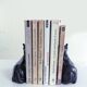 Black marble bookends with lying horses