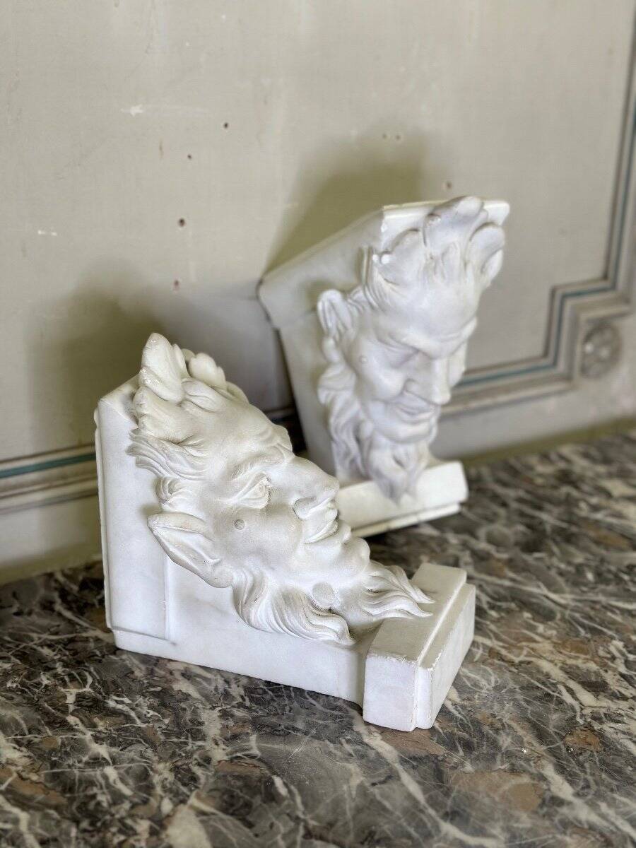 Pair of white statuary marble consoles, with faun heads