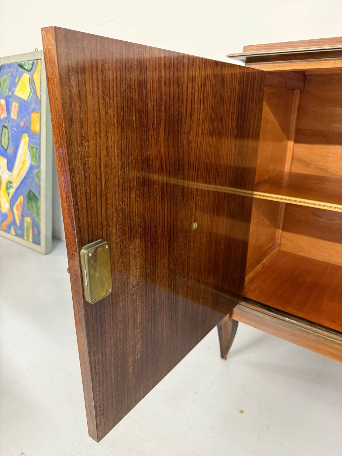 Antique art deco sideboard from the 1930s with veneered wood and bronze insert