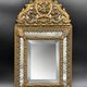 Small mirror with brass parcloses in repoussé style Louis XIV, late 19th century.