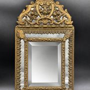 Small mirror with brass parcloses in repoussé style Louis XIV, late 19th century.