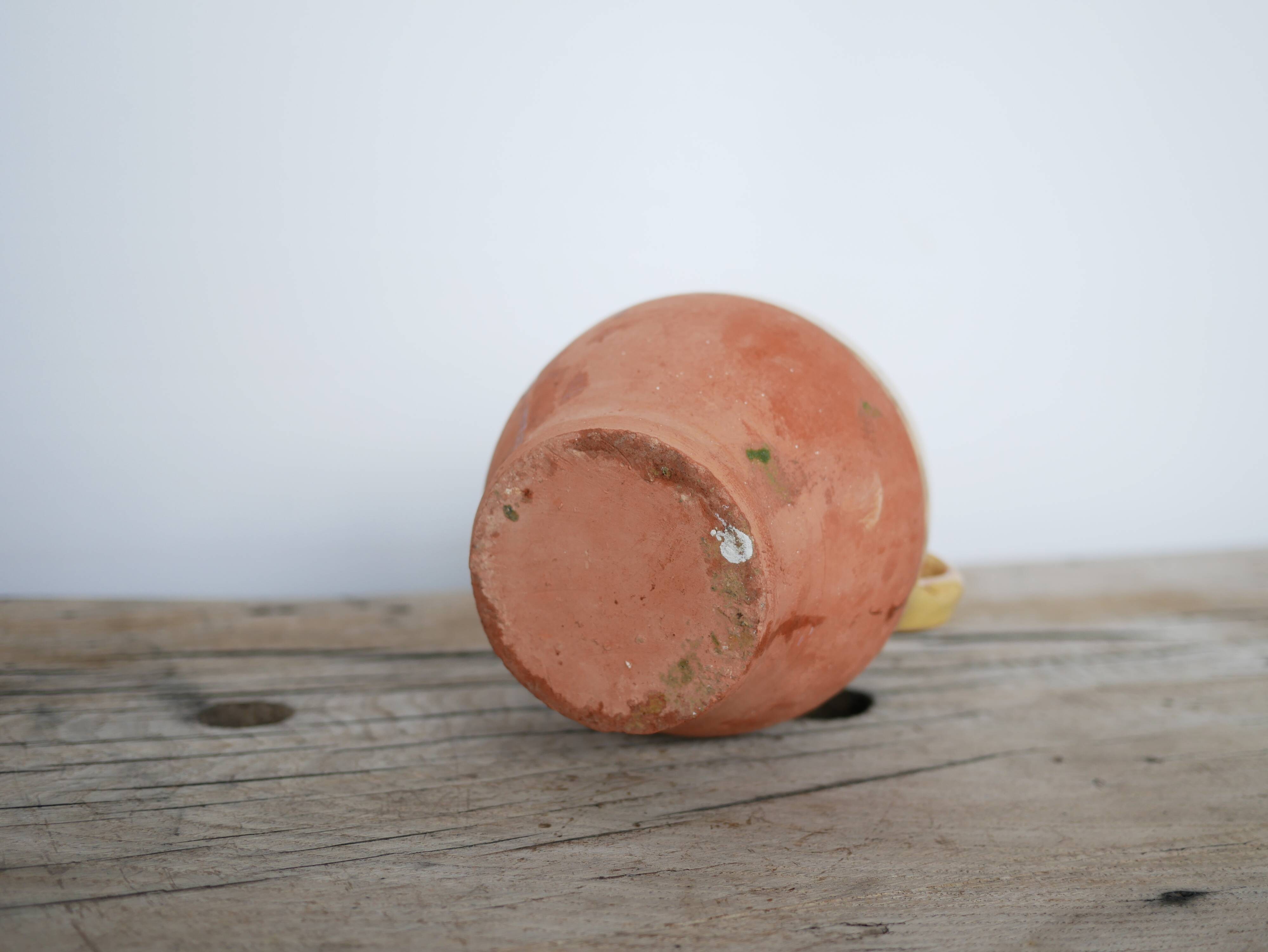 Old gargoulette pot in glazed terracotta