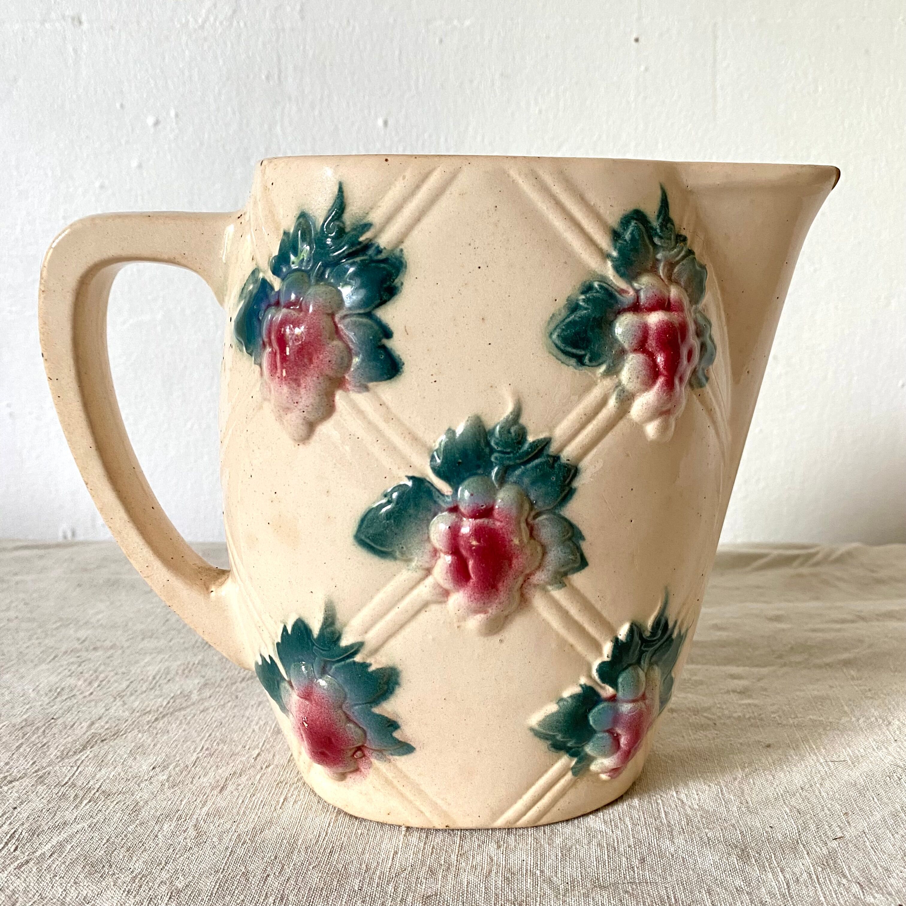 Antique pitcher in Digoin slip