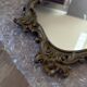 Antique mirror in Louis XV Rocaille style with carved frame.