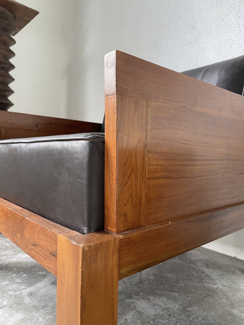 Modernist armchair in exotic wood and leather