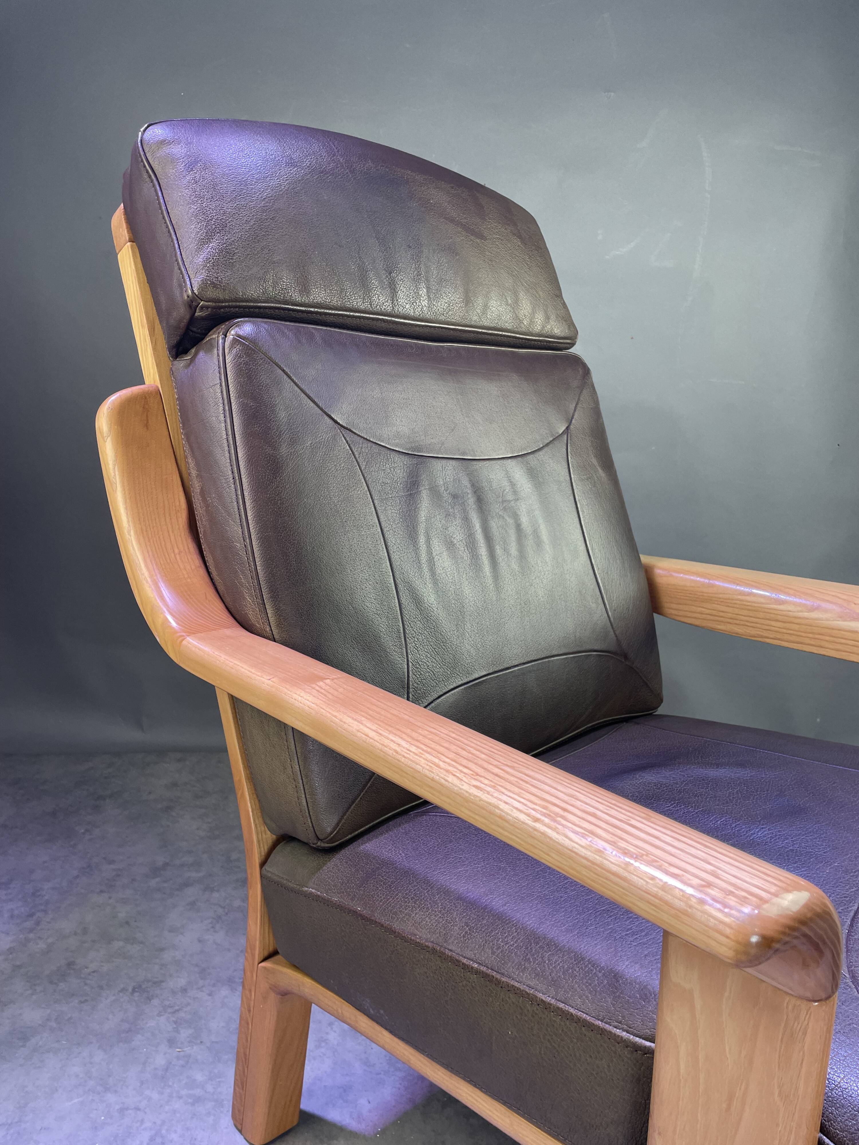 Chocolate leather armchair, wooden structure
