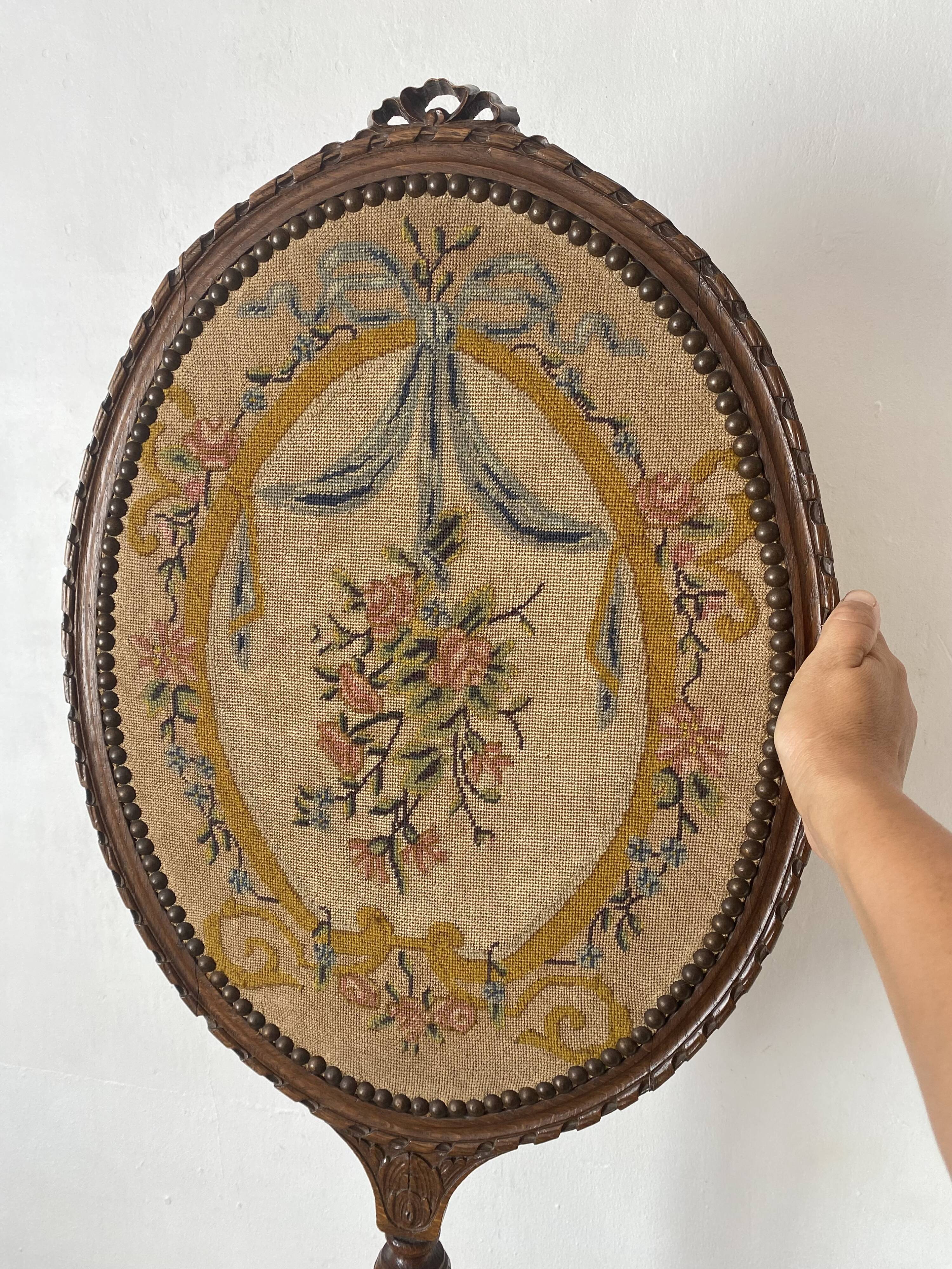 Wooden and embroidered fabric fireplace screen