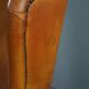 Wingback chair made of sheepskin leather in a light honey color