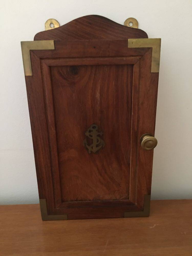 Key box in wood and brass and central motif representing a sailor's anchor