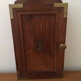 Key box in wood and brass and central motif representing a sailor's anchor