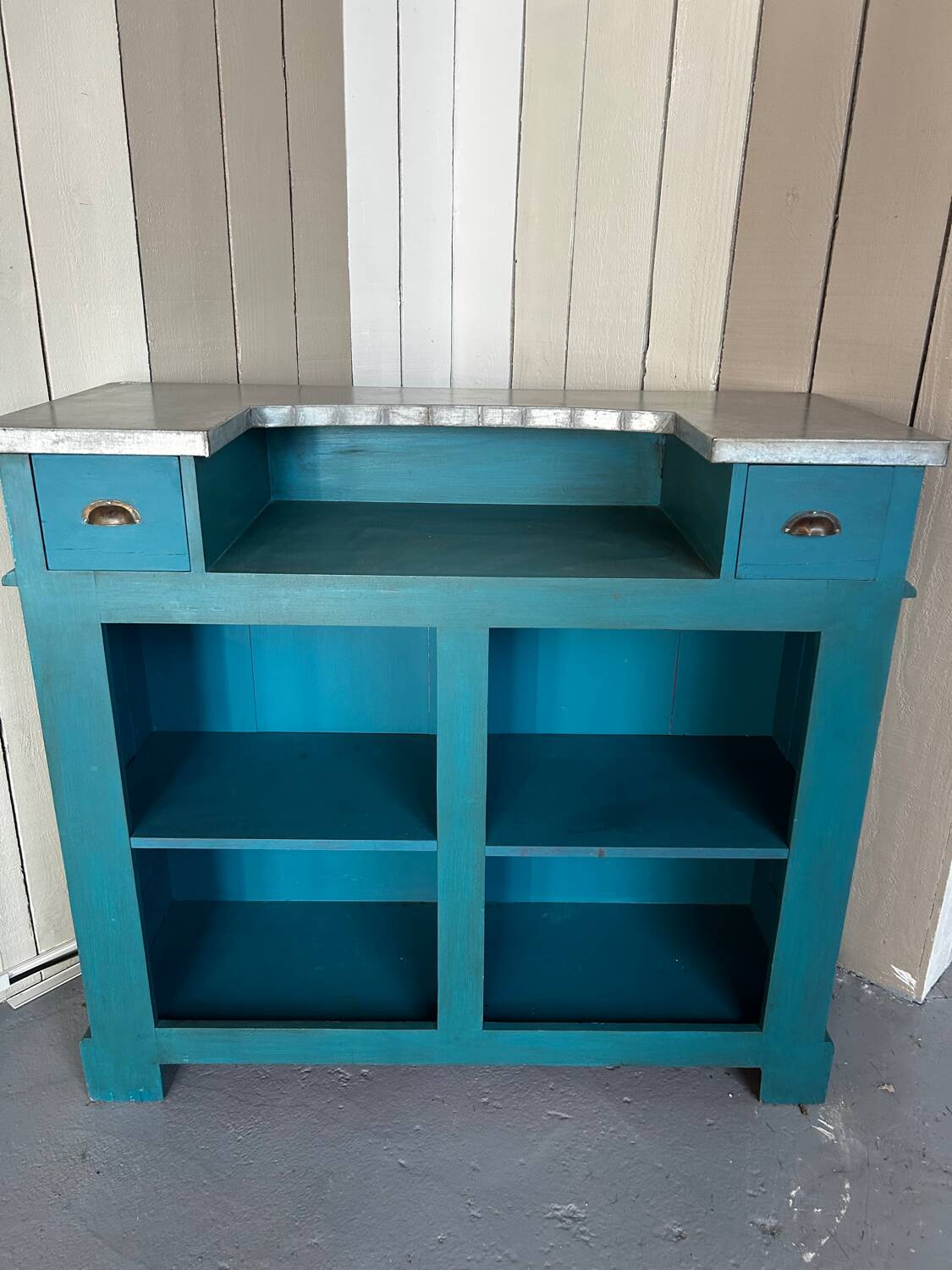 Old wooden trade counter with a zinc top.