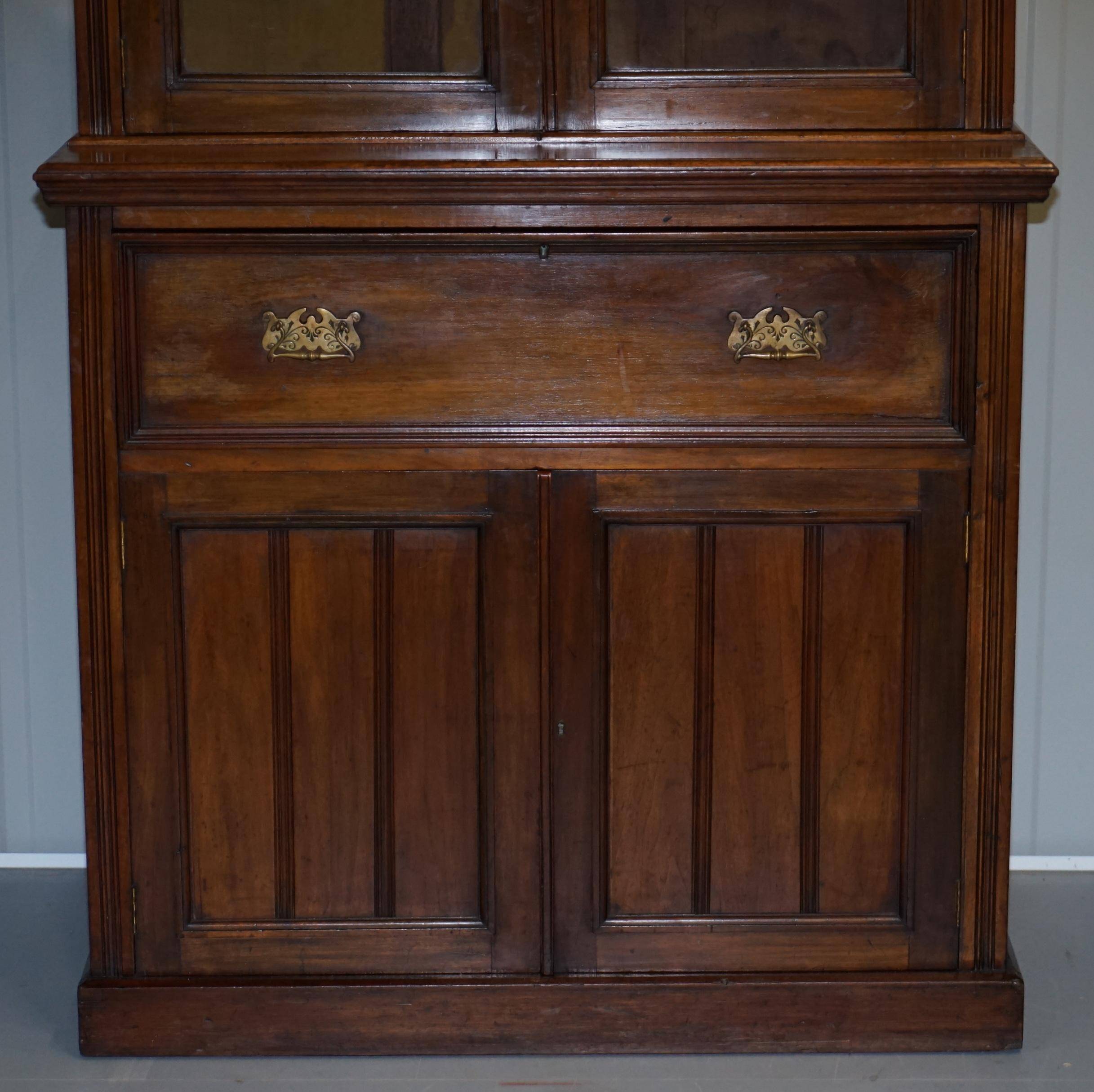 Light wood library with a secretary and leather surface.