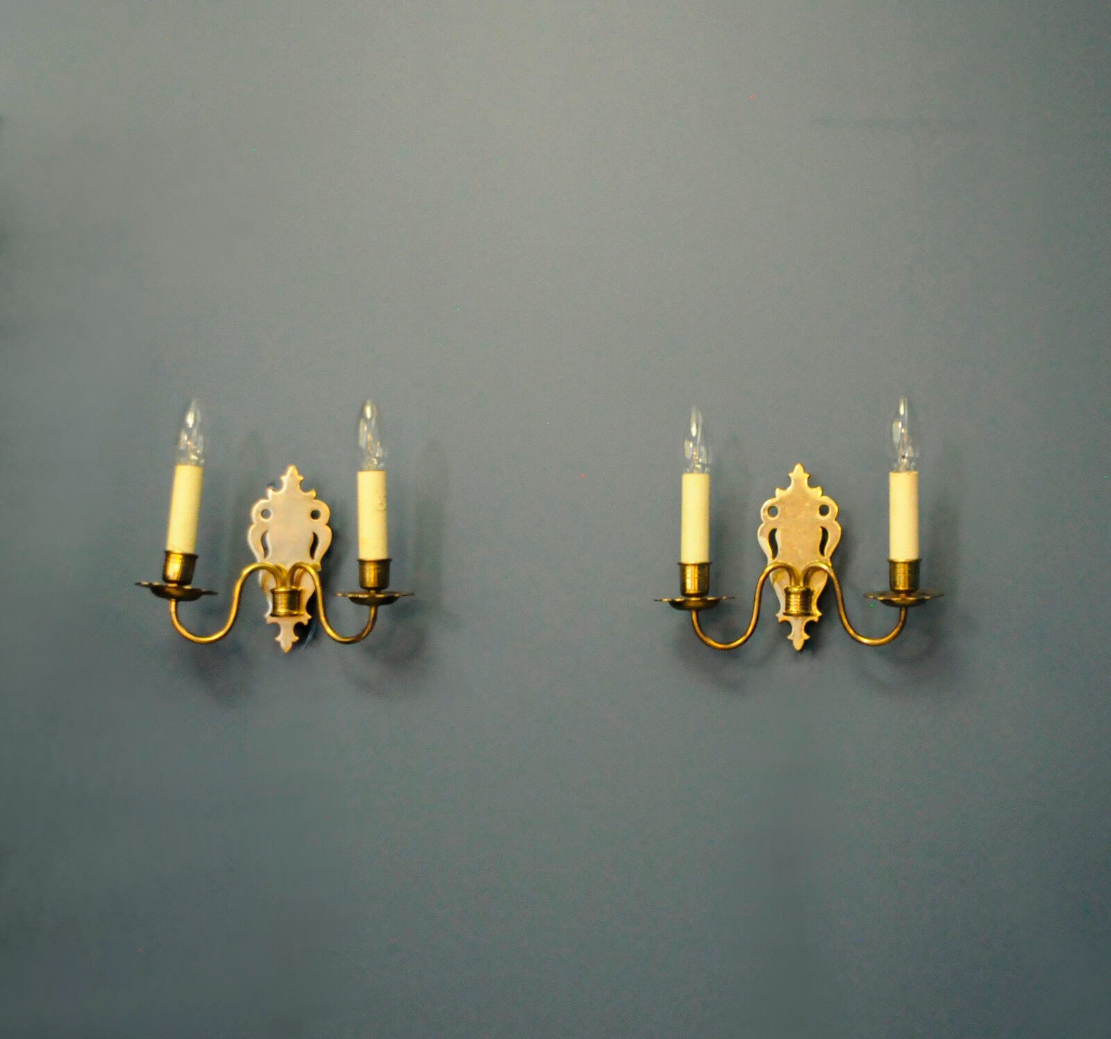 Pair of brass wall sconces by Schroder & Co