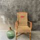 Vintage braided rattan armchair