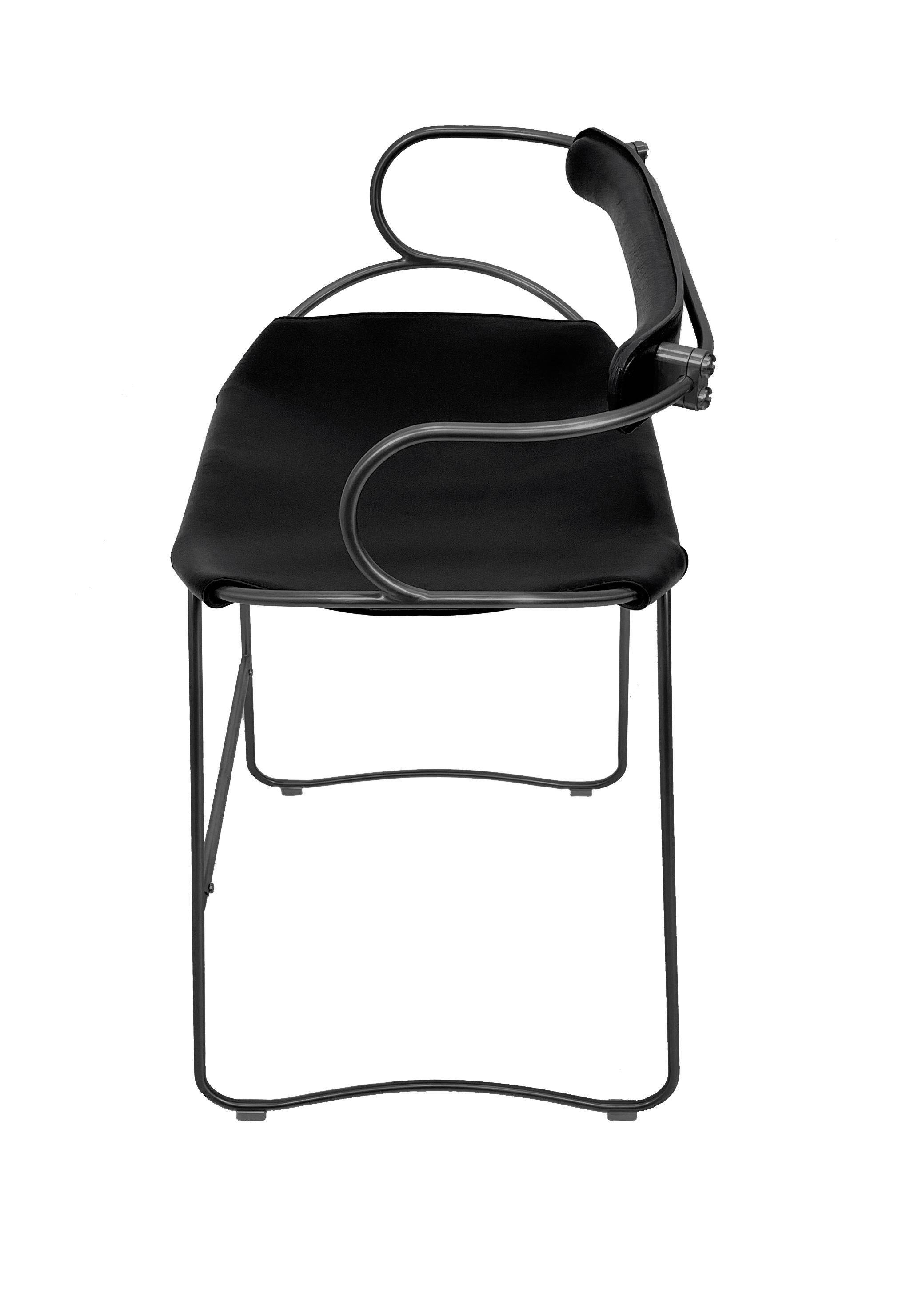 Contemporary sculptural bar stool c. Black smoked metal backrest and black leather.