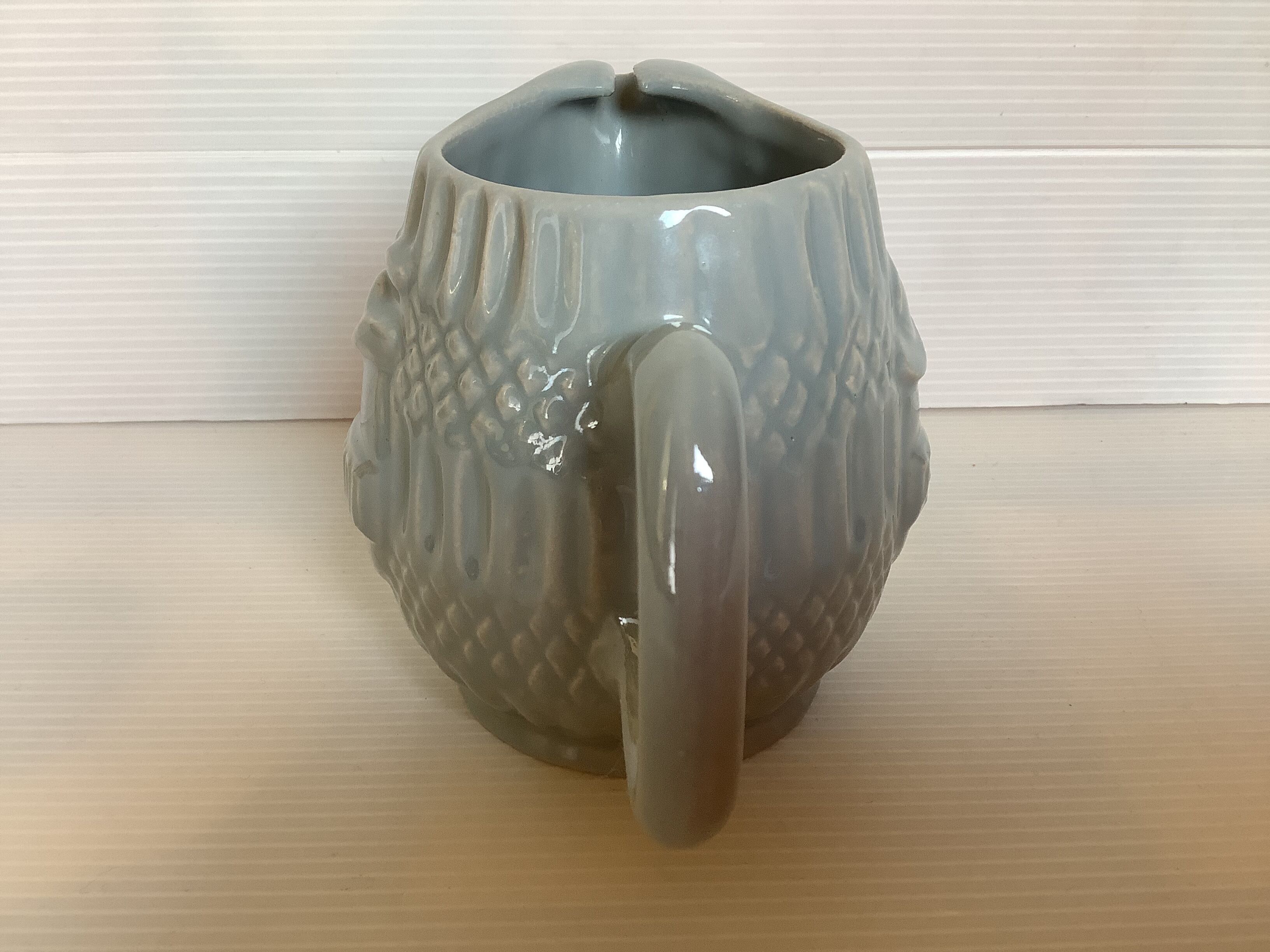 Old grey earthenware Pernod jug