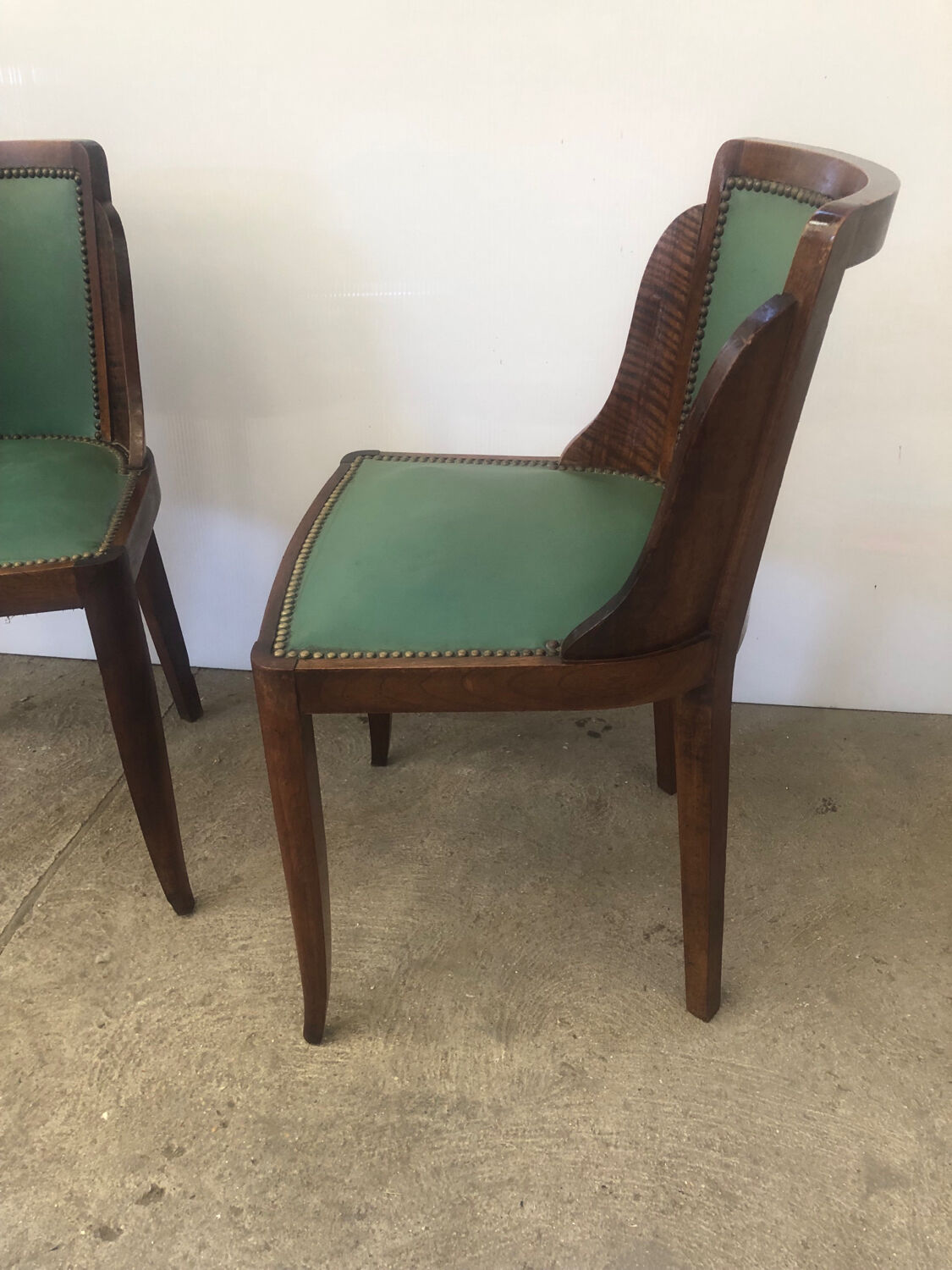 Pair of old wood and green leather gondola chairs