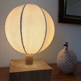 Handmade wooden ball lamp on a stand