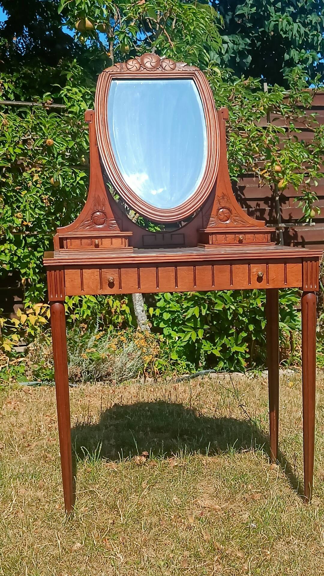 Art Deco oak dressing table, marble top and swivel mirror.